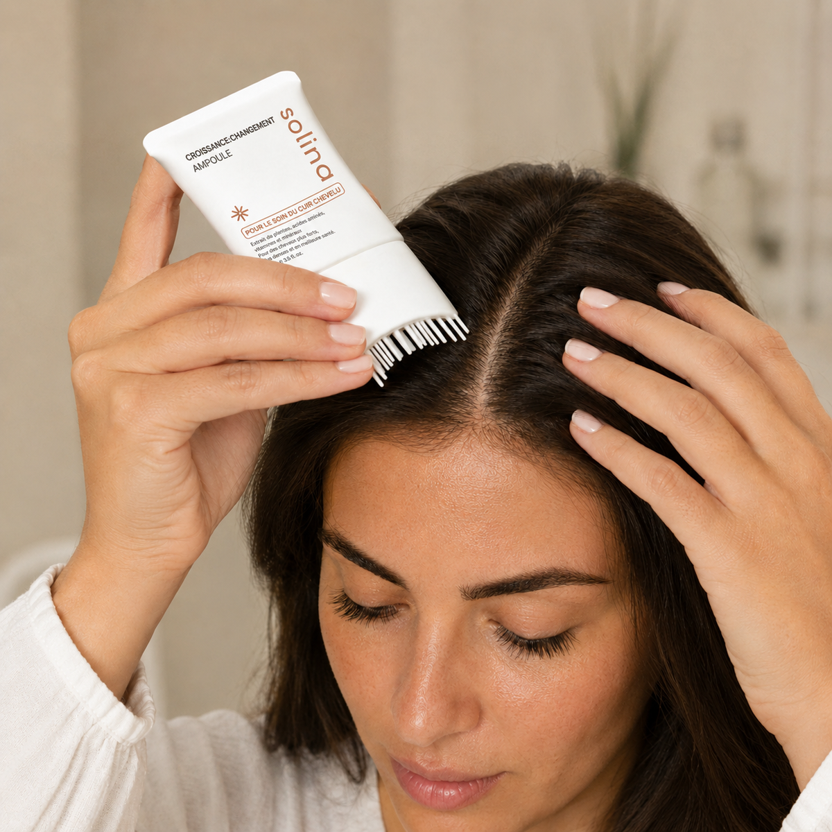 Etape 1, applique le serum Solina sur le cuir chevelu